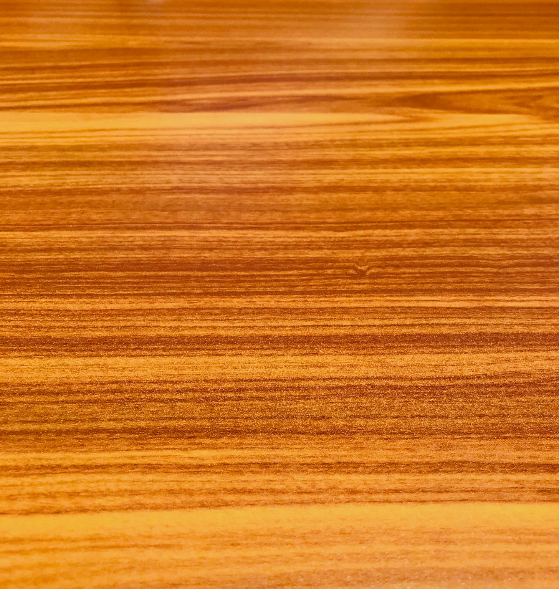 Golden, honey, cherry wood grain background perfect for a wallpaper or a text or image overlay